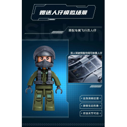 Nhân vật phi công đội mũ bảo hộ trong bộ Sluban M38-B1612, phía sau là buồng lái đôi đủ chỗ đặt người